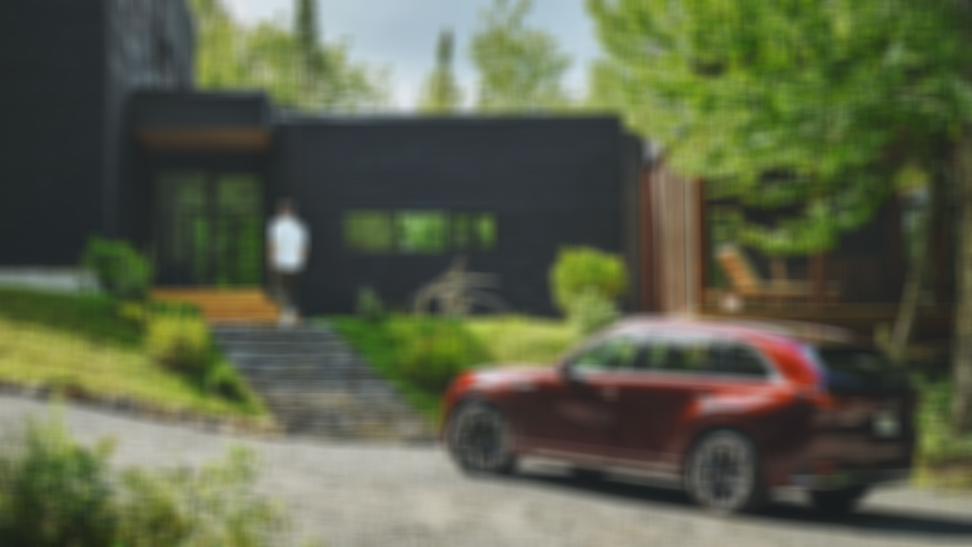 A Mazda vehicle driving down a road on Fogo Island.