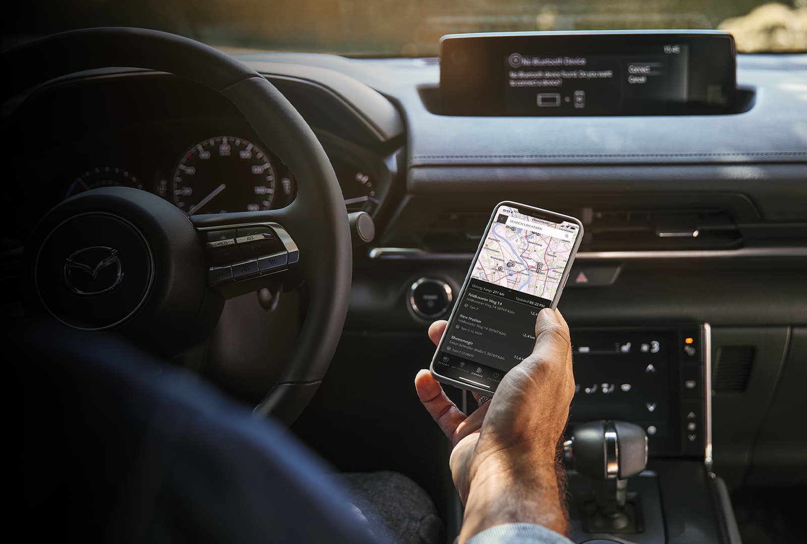 Mazda Owner connecting their phone to the car.